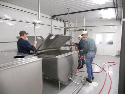 Creamworks Dairy employees dealing machinery